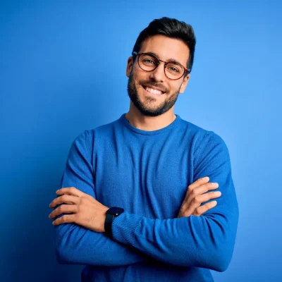 opti relaxed guy in blue shirt standing SH